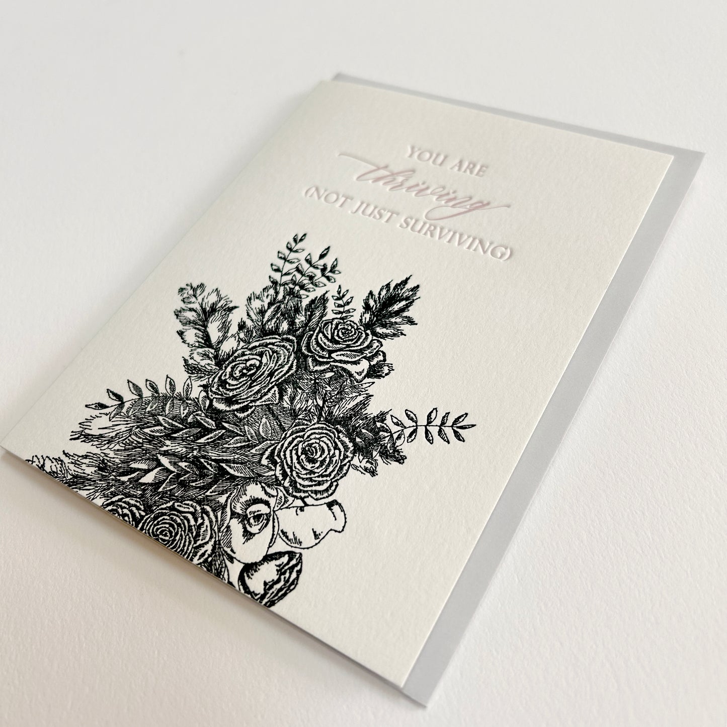 Letterpress friendship card with black florals that reads "You are thriving (not jut surviving) by Rust Belt Love