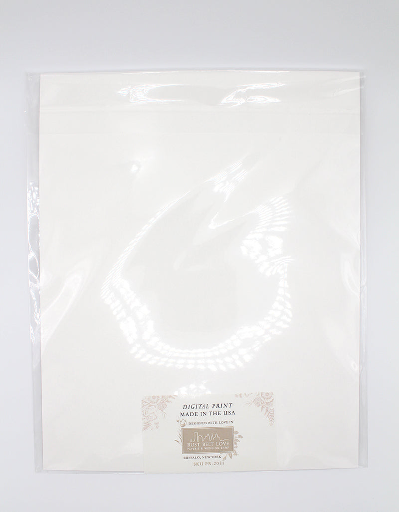 The back of floral print by Rust Belt Love, in the plastic packaging