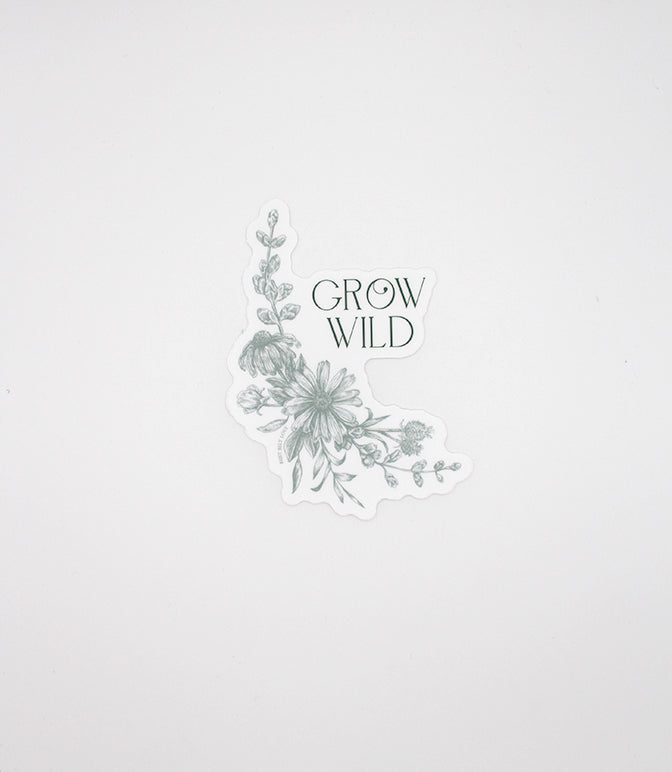 Green floral sticker that reads "Grow wild", by Rust Belt Love