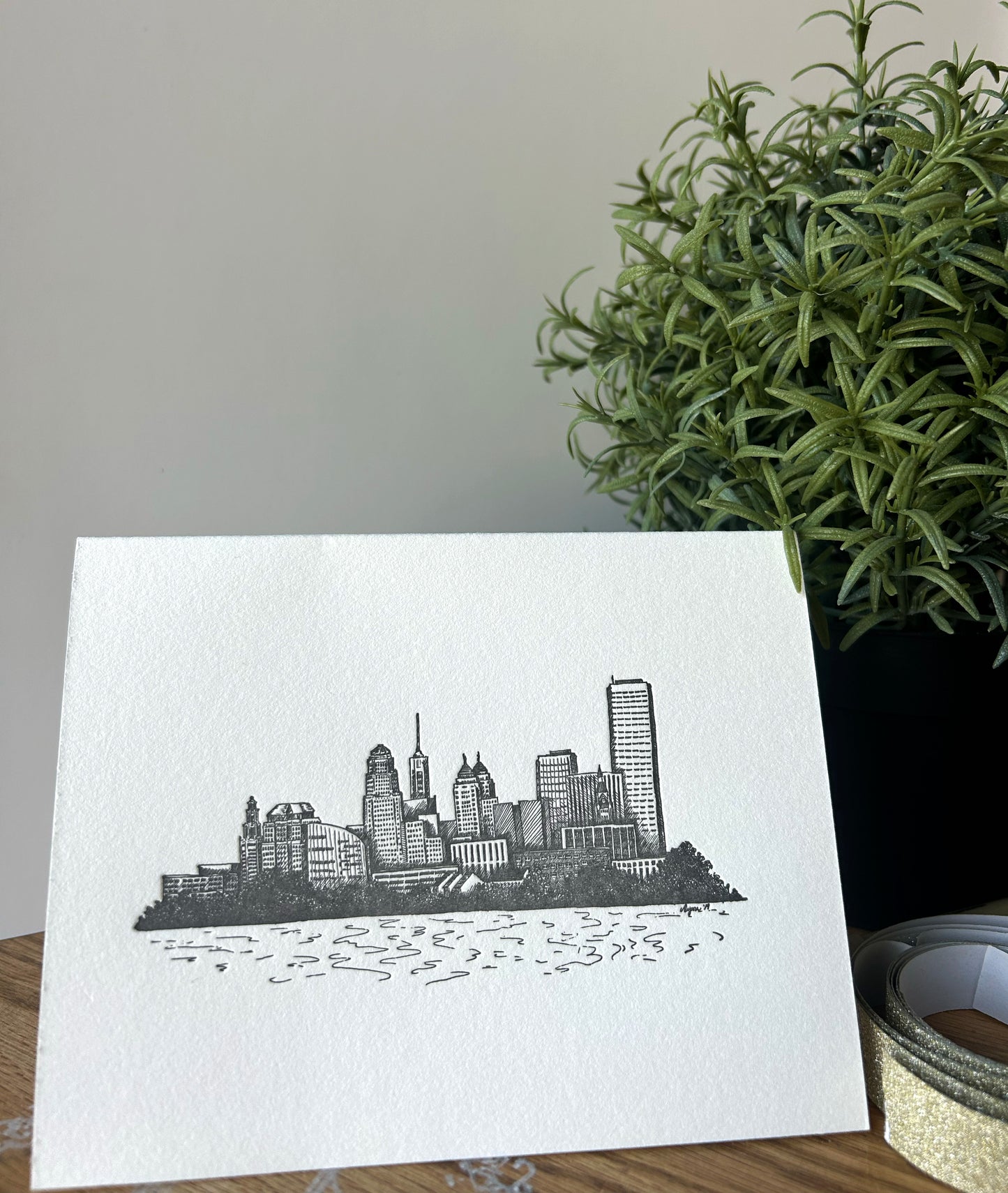 Style shot of letterpress greeting card with buffalo skyline by Rust Belt Love