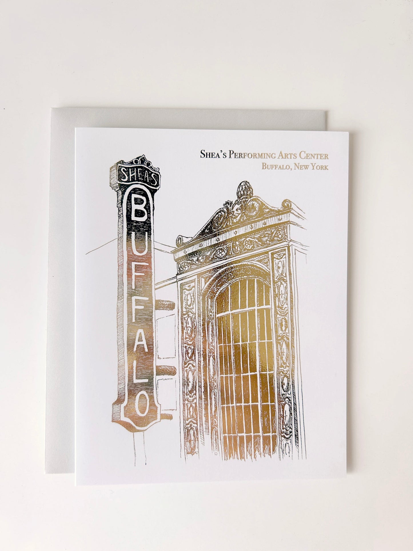 Gold foil illustration that says "Shea's Performing Arts Center Buffalo, New York" designed by Rust Belt Love