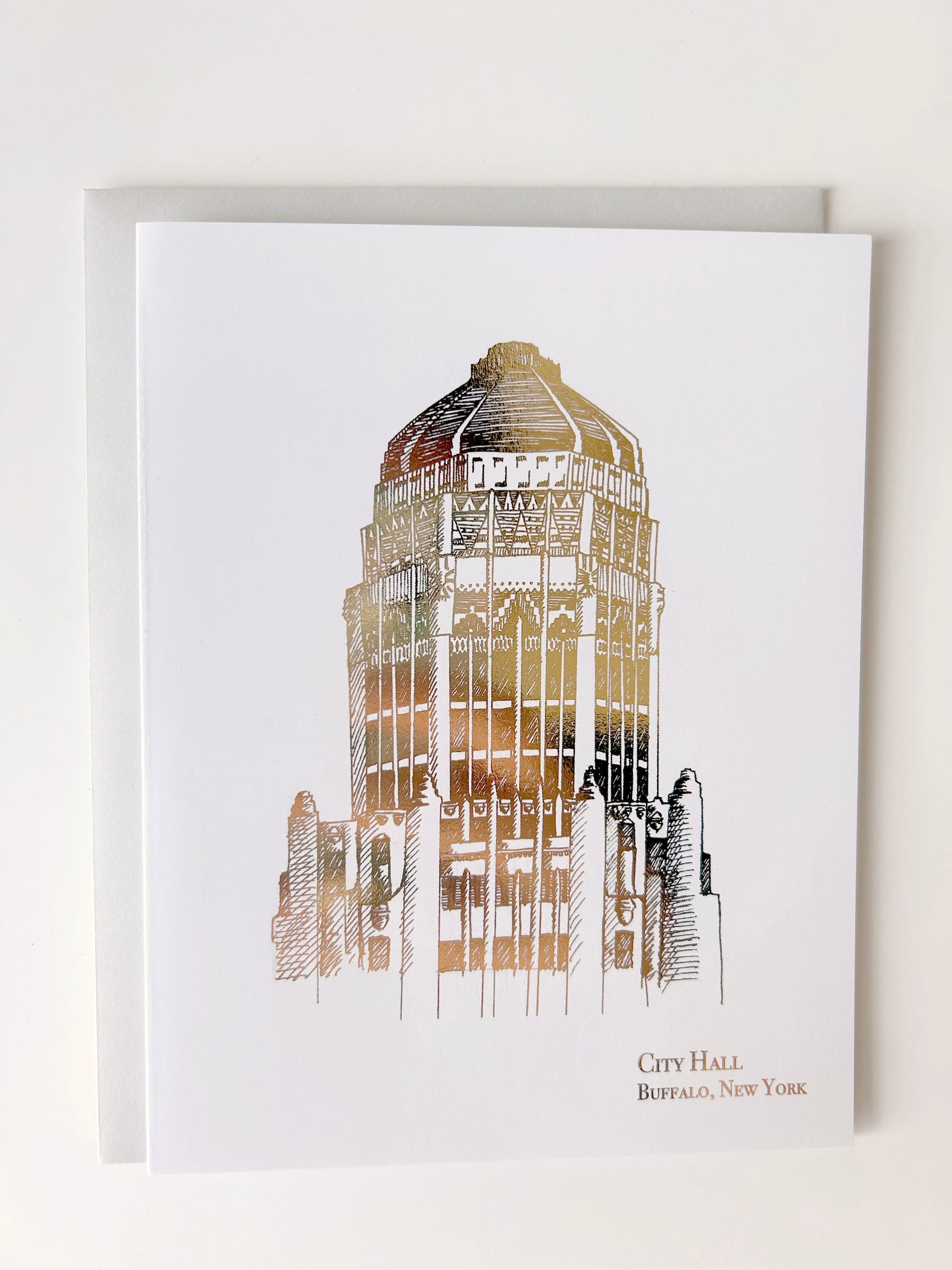 Gold foil illustration that says "City Hall Buffalo, New York" designed by Rust Belt Love