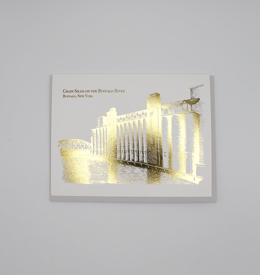 Gold foil greeting card with illustration that reads " Grain silos on the buffalo river Buffalo, New York", by Rust Belt Love