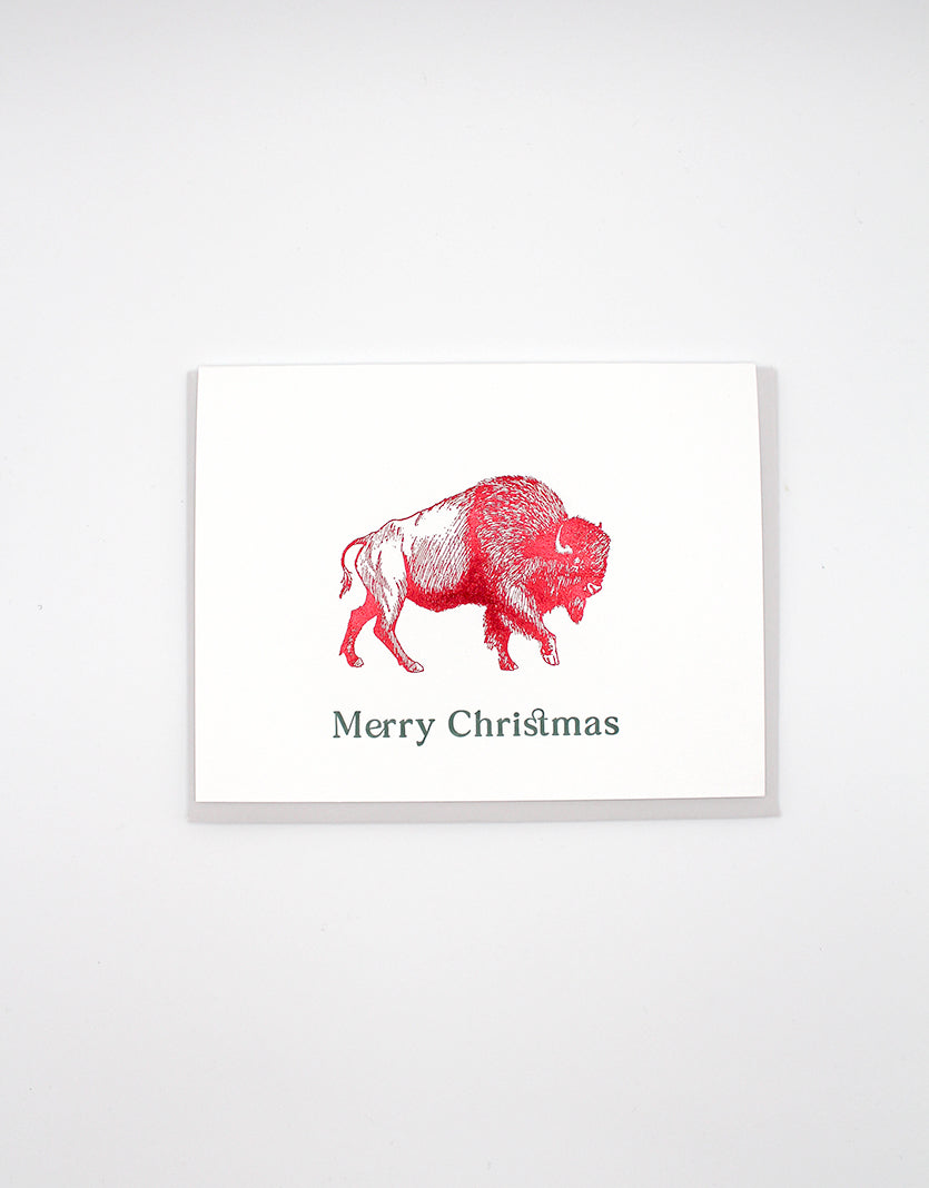 Red foil buffalo greeting card by Rust Belt Love that reads "Merry Christmas"