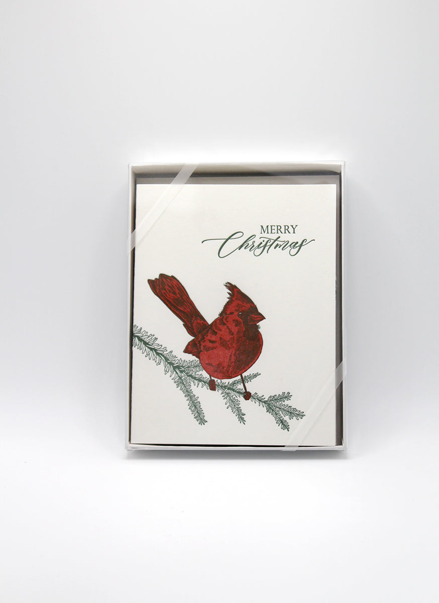 Box of letterpress holiday cards with cardinal that says "Merry Christmas" by Rust Belt Love