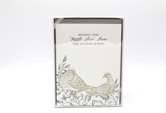 Box of letterpress holiday greeting cards with two turtle doves on it that reads "Sending you turtle dove love this holiday season" by Rust Belt Love