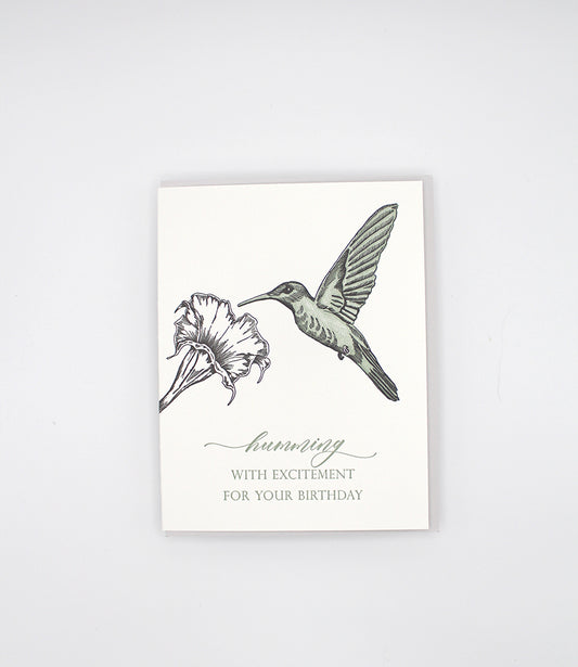 Letterpress birthday card with a flower and humming bird that reads "humming by with excitement for you birthday", by Rust Belt Love