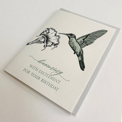 Letterpress birthday card with a flower and humming bird that reads "humming by with excitement for you birthday", by Rust Belt Love