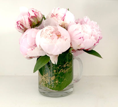 Gold ink on clear glass mug with flowers and that says "but first..." by Rust Belt Love