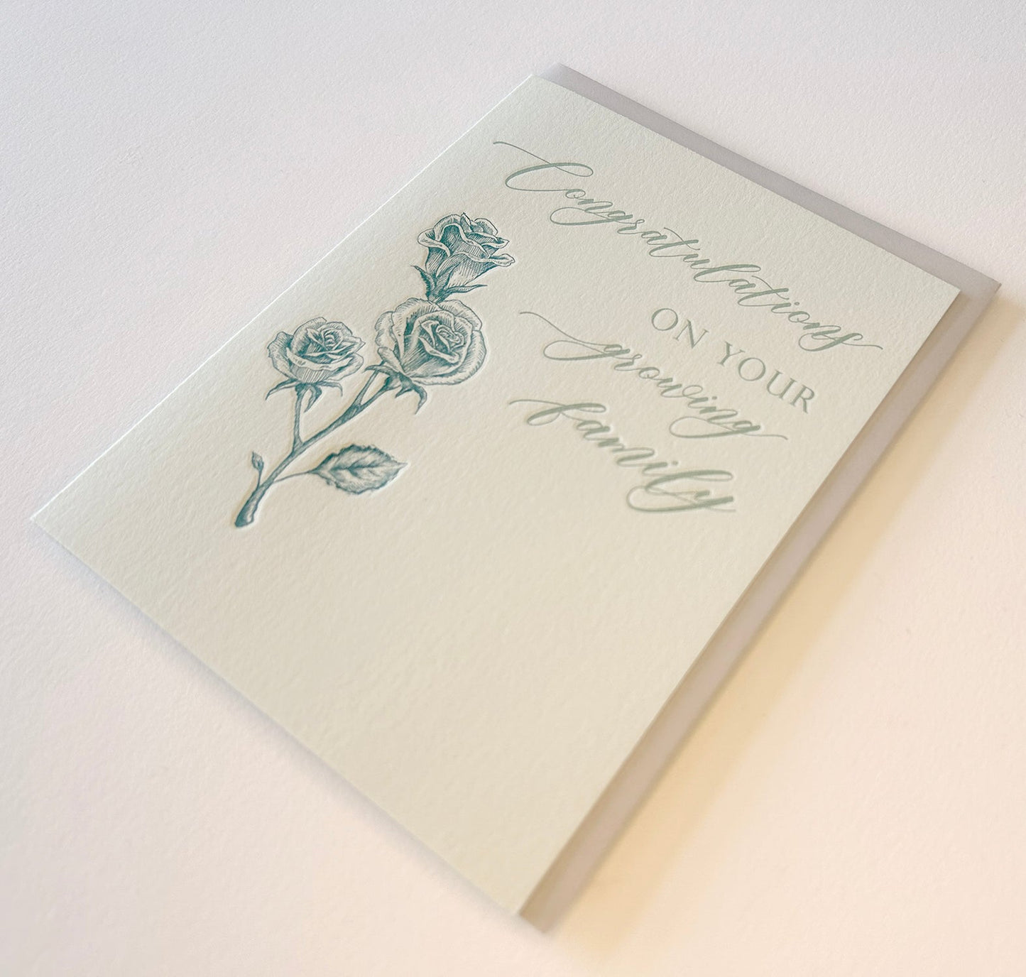 Letterpress congrats card with florals that says "Congratulations On Your Growing Family" by Rust Belt Love