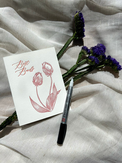 Style shot of Rust Belt Love's letterpress friendship card with tulips that reads "Best Buds"