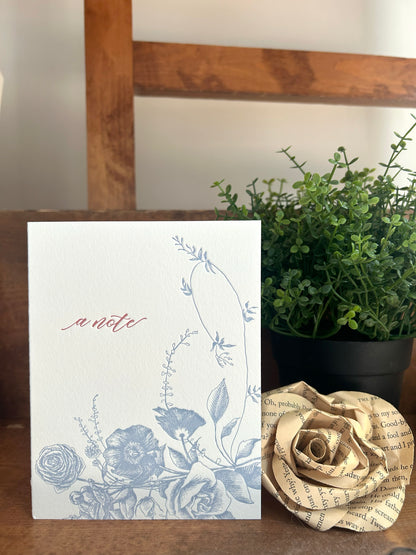 Style shot of letterpress greeting card with florals that reads "A note" by Rust Belt Love