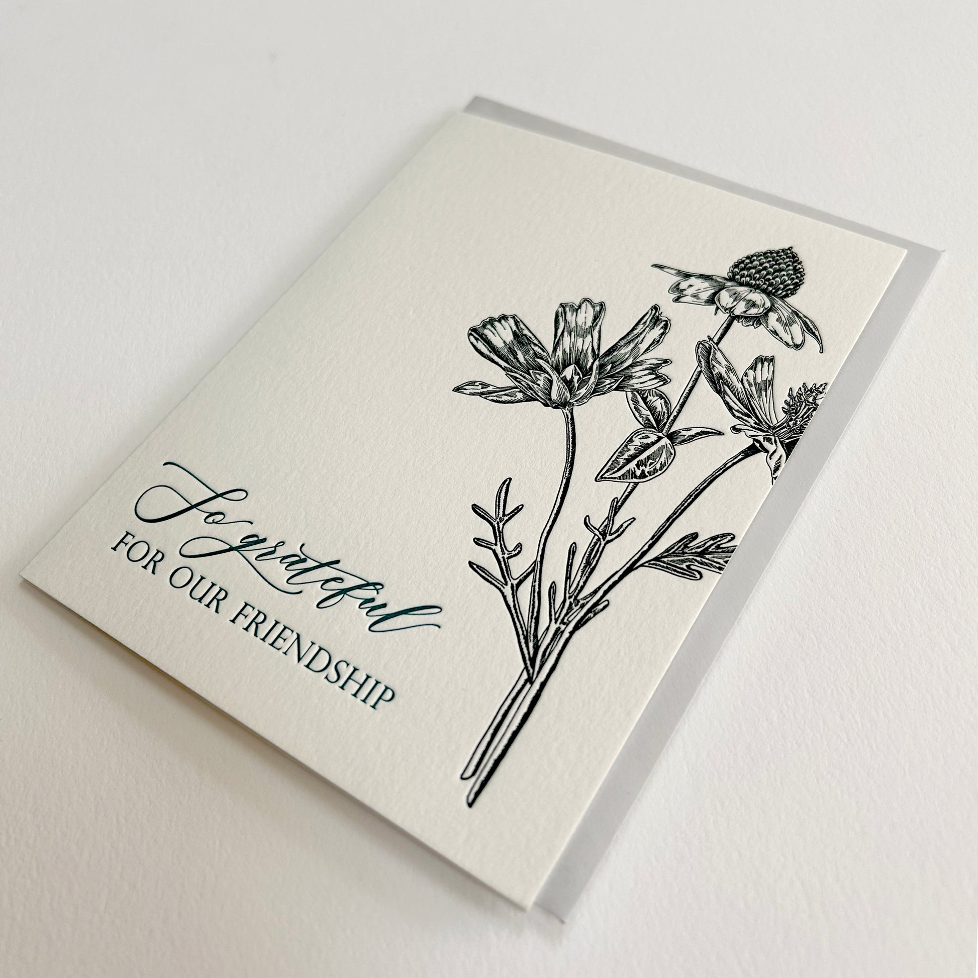 Letterpress friendship card with black florals that reads "so grateful for our friendship", by Rust Belt Love