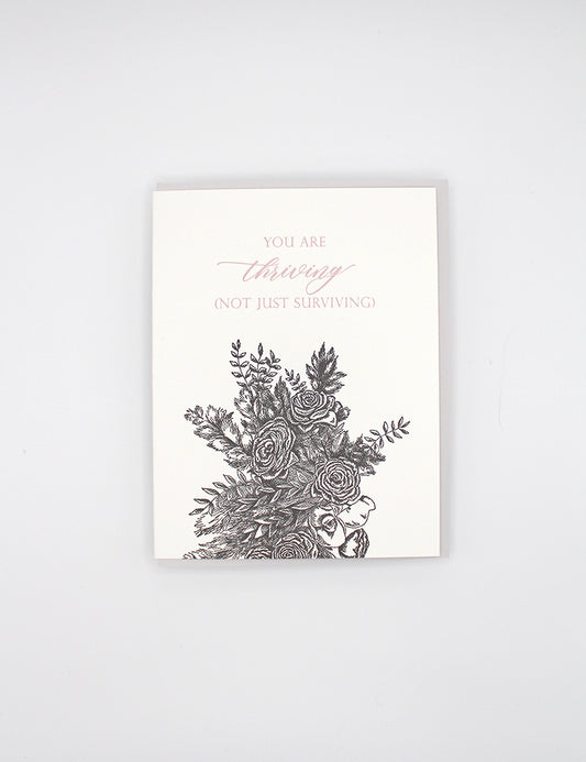 Letterpress friendship card with black florals that reads "You are thriving (not jut surviving) by Rust Belt Love