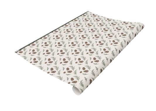 Roll of Rust Belt Love's pinecone and greenery patterned wrapping paper