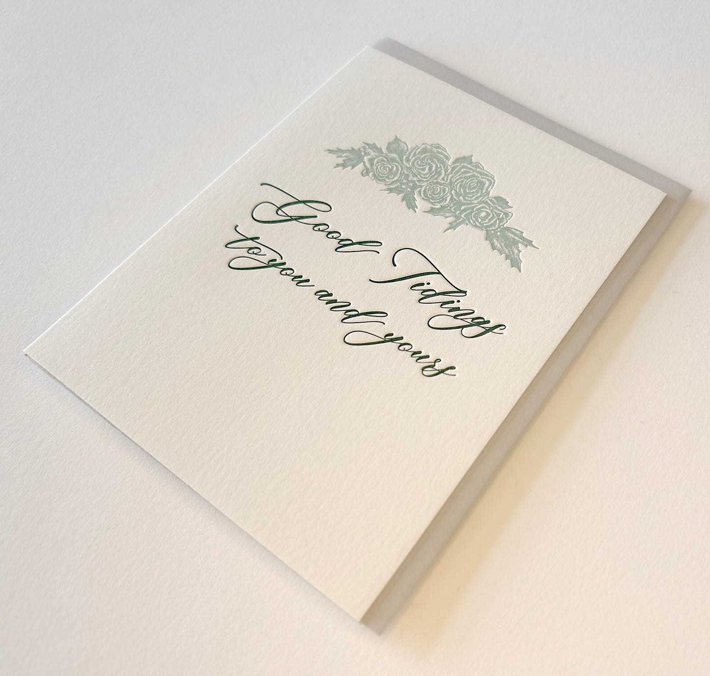 Letterpress holiday card with florals that says " Good tidings to you and yours" by Rust Belt Love