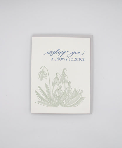 Letterpress holiday card with snowdrop flowers that says "Wishing You A Snowy Solstice" by Rust Belt Love