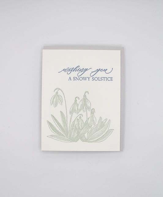 Letterpress holiday card with snowdrop flowers that says "Wishing You A Snowy Solstice" by Rust Belt Love