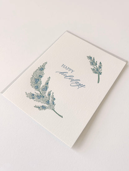 Letterpress holiday card with greenery that says "Happy Holidays" by Rust Belt Love