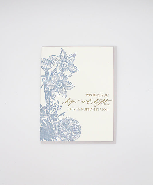 Letterpress holiday card with florals that reads "Wishing you hope and light this Hanukkah season", by Rust Belt Love