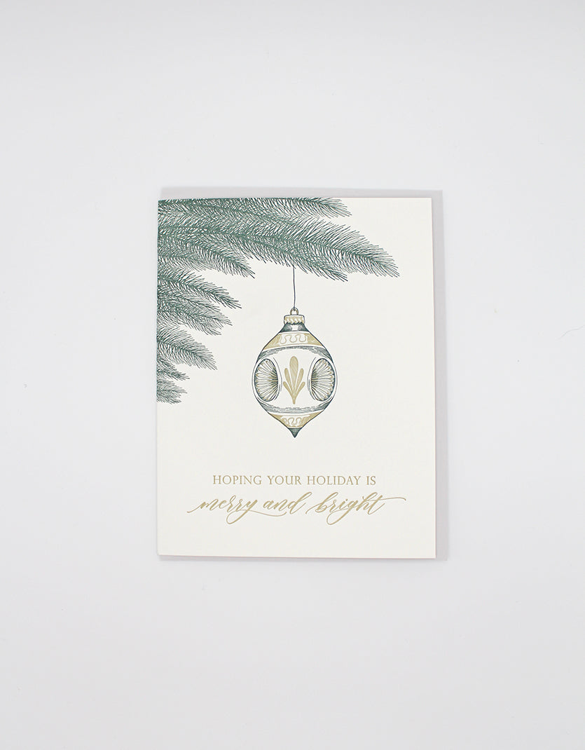 Letterpress holiday card with tree branch and ornament that reads "Hoping your holiday is merry and bright" by Rust Belt Love