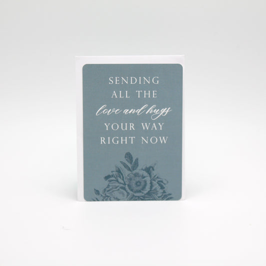 Blue floral minicard that reads "Sending all the love and hugs your way right now" by Rust Belt Love