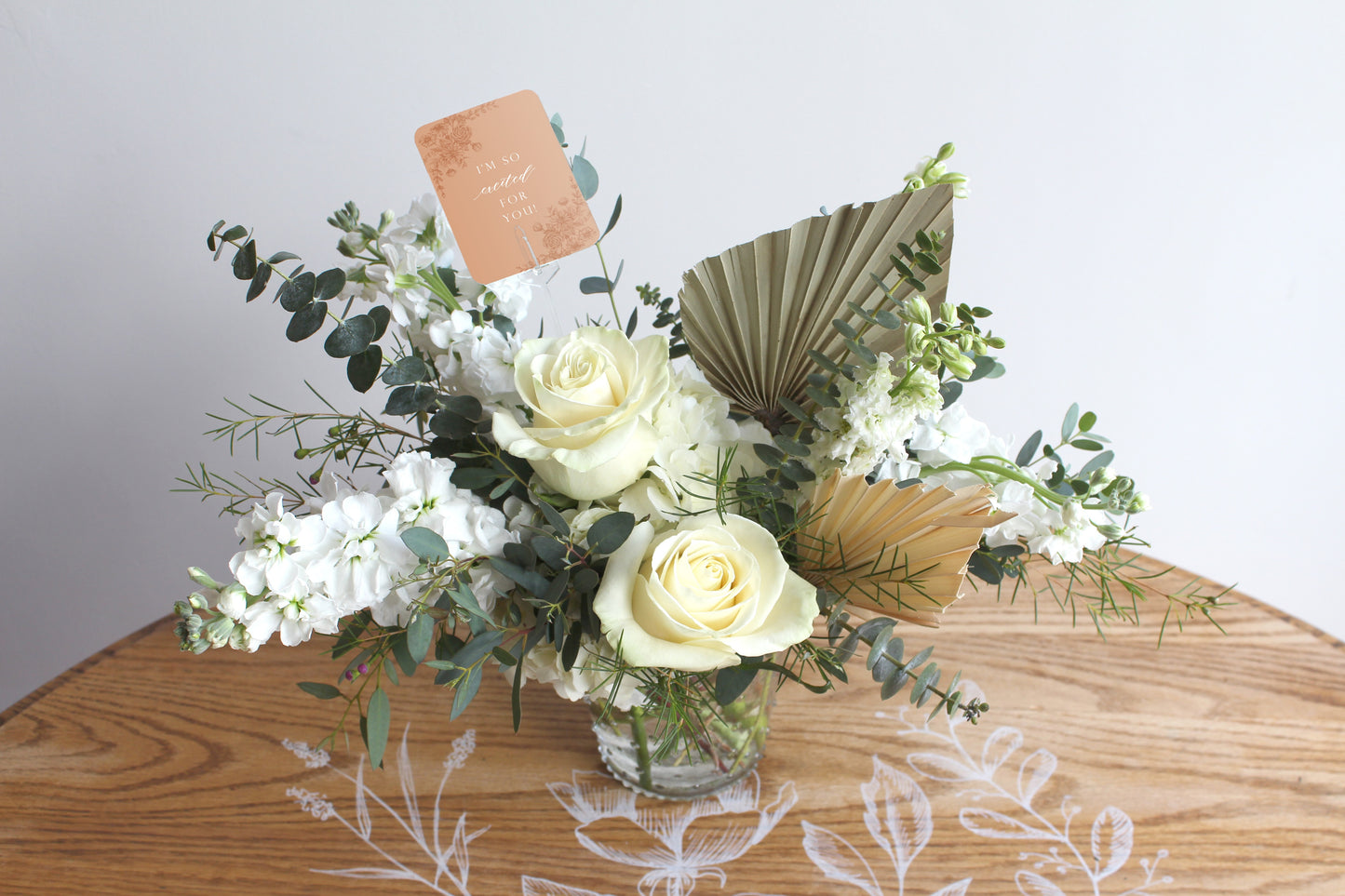 Style shot of Rust Belt Love's orange floral minicard in a bouquet that reads "I'm so excited for you!"