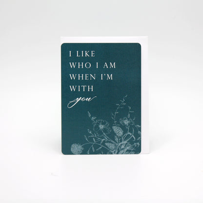 Dark teal floral minicard that reads "I like who I am when I'm with you" from Rust Belt Love