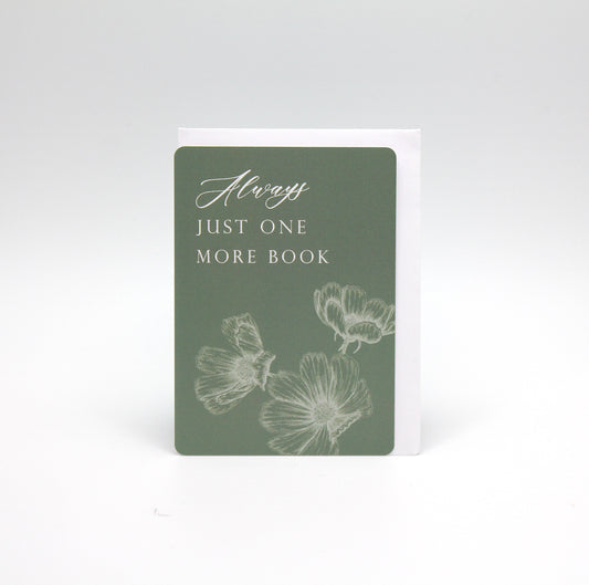 Green minicard with florals that reads "Always just one more book" by Rust Belt Love