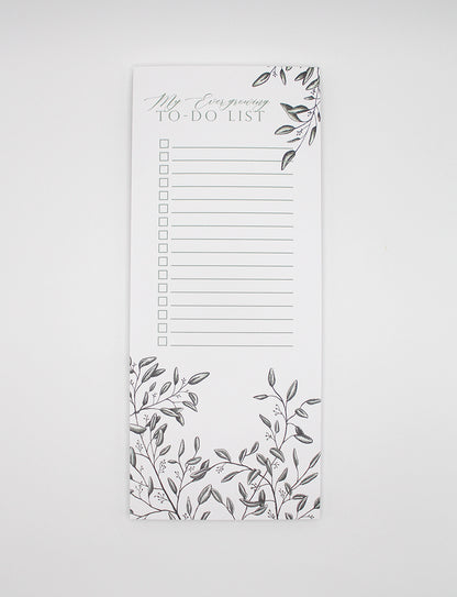 Style shot of a 3.5 by 8.5 notepad with lined sheets with florals that says "My ever-growing to-do list" by Rust Belt Love