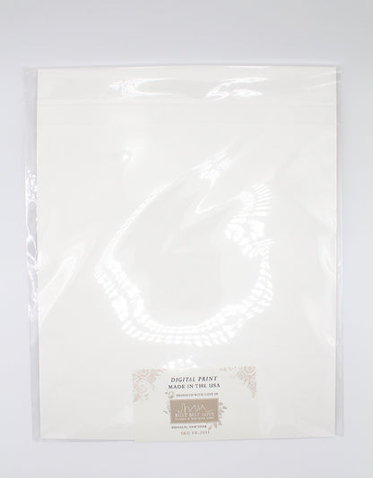 The back of floral print by Rust Belt Love, in the plastic packaging