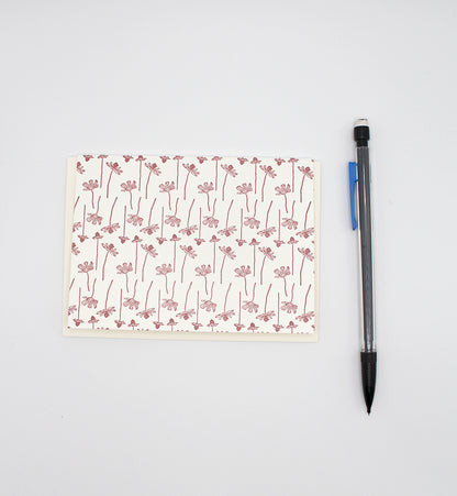 Small letterpress note card with linear floral pattern by Rust Belt Love, with pencil for size