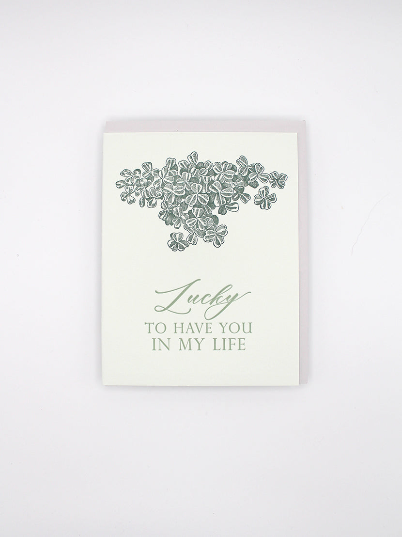 Letterpress card with shamrocks that says "Lucky to have you in my life" by Rust Belt Love