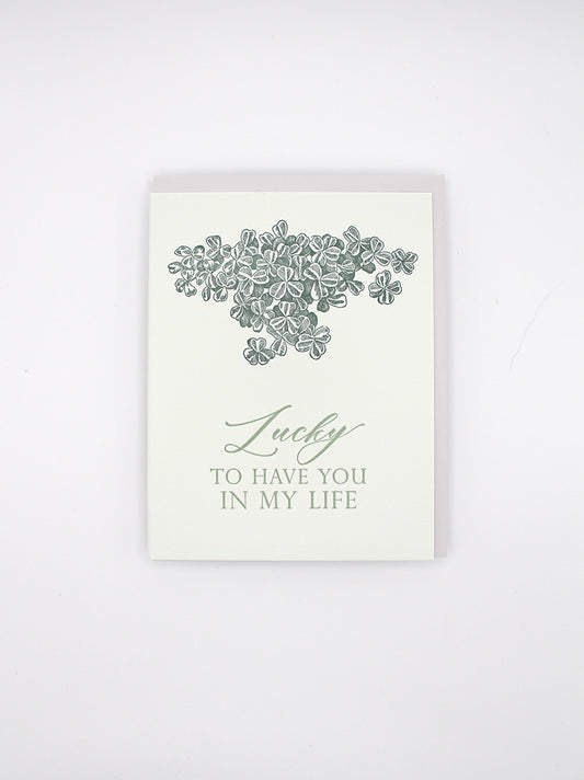 Letterpress card with shamrocks that says "Lucky to have you in my life" by Rust Belt Love