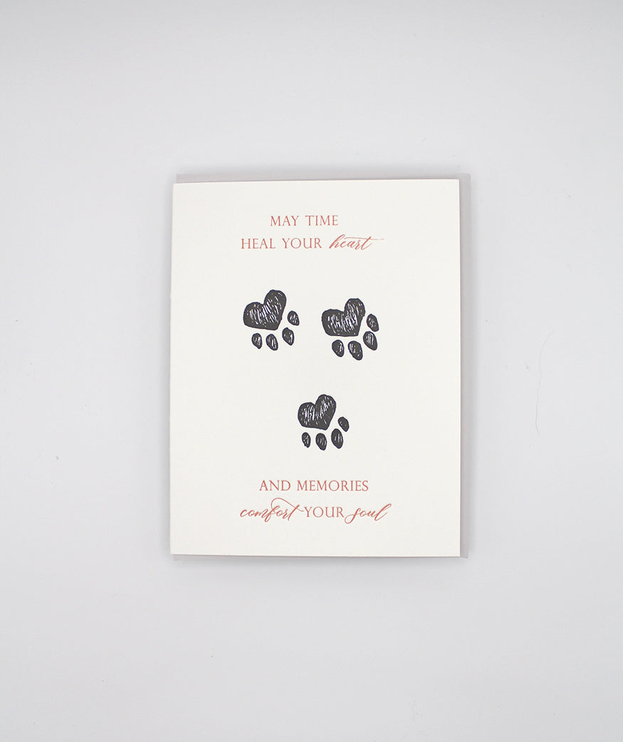 Letterpress sympathy cards with paw prints from Rust Belt Love, that reads "May time heal your heart and memories comfort your soul"