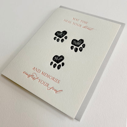 Letterpress sympathy cards with paw prints from Rust Belt Love, that reads "May time heal your heart and memories comfort your soul"