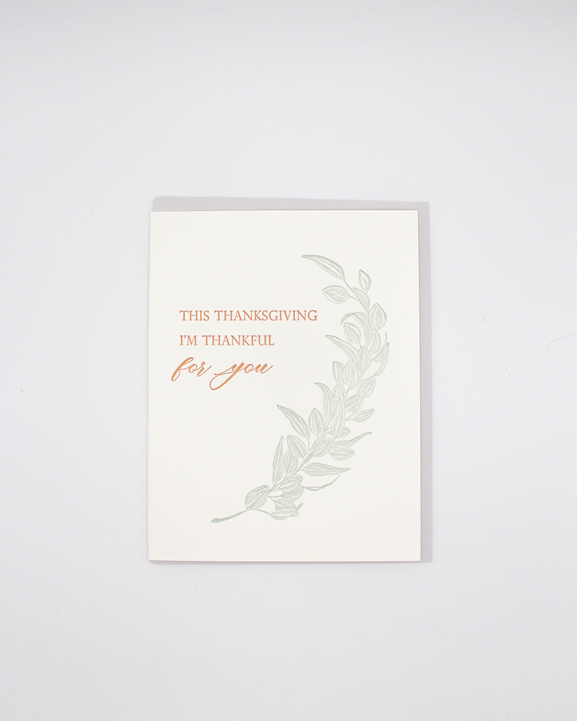 Letterpress thanksgiving card with greenery that says "This Thanksgiving I'm Thankful For You" by Rust Belt Love