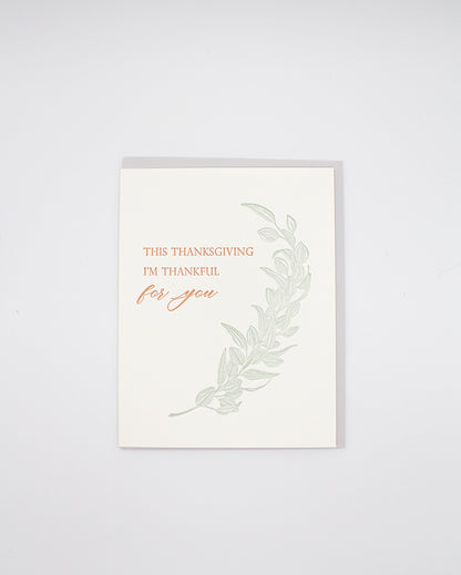 Letterpress thanksgiving card with greenery that says "This Thanksgiving I'm Thankful For You" by Rust Belt Love
