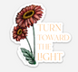 Floral sticker from Rust Belt Love that reads "Turn towards the light"