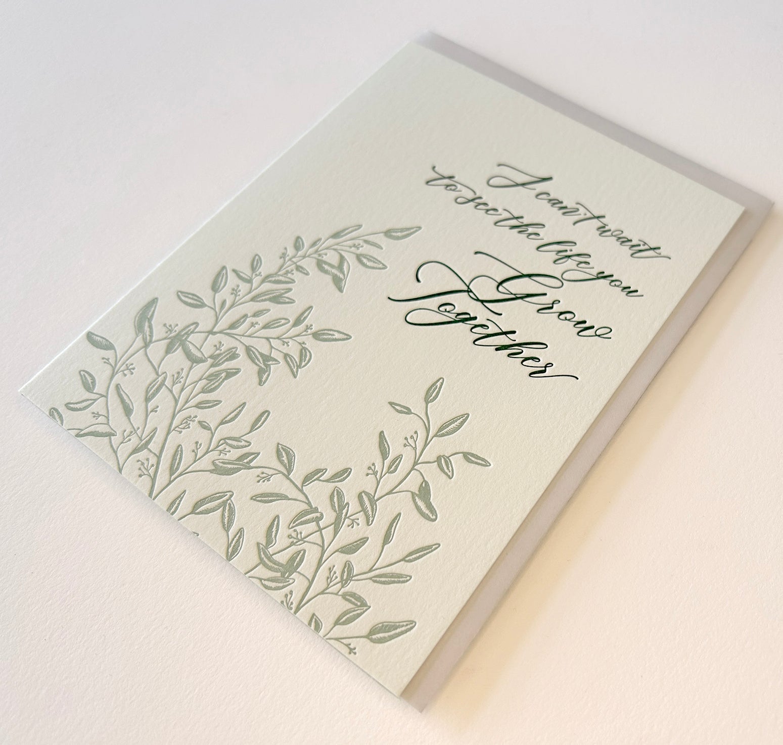 Letterpress wedding card with florals that says "I can't wait to see the life you grow together" by Rust Belt Love