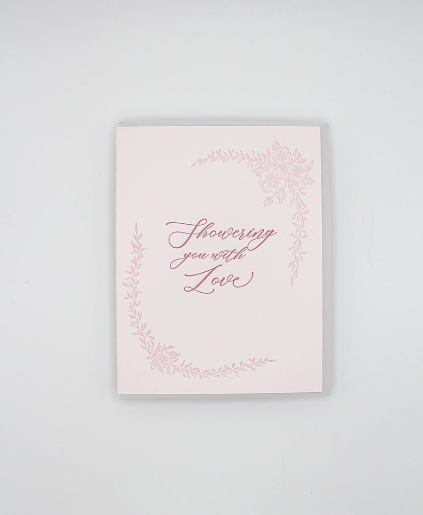 Letterpress love card with florals that says "Showering you with love" by Rust Belt Love