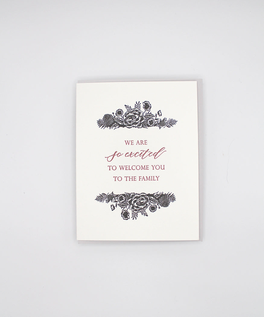 Letterpress greeting card with black florals that reads "We are so excited to welcome you to the family" by Rust Belt Love