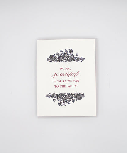 Letterpress greeting card with black florals that reads "We are so excited to welcome you to the family" by Rust Belt Love