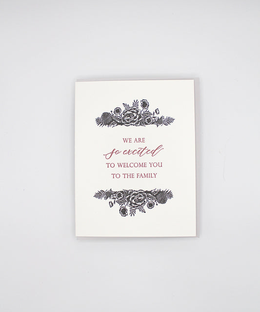 Letterpress greeting card with black florals that reads "We are so excited to welcome you to the family" by Rust Belt Love