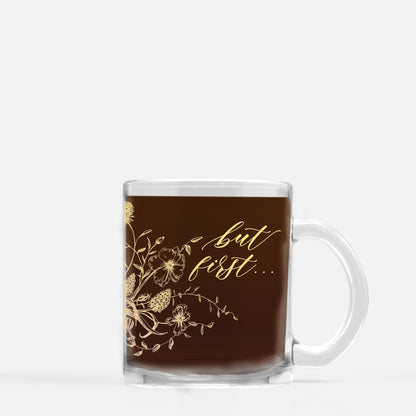 Gold ink on clear glass mug with coffee that says "but first..." by Rust Belt Love
